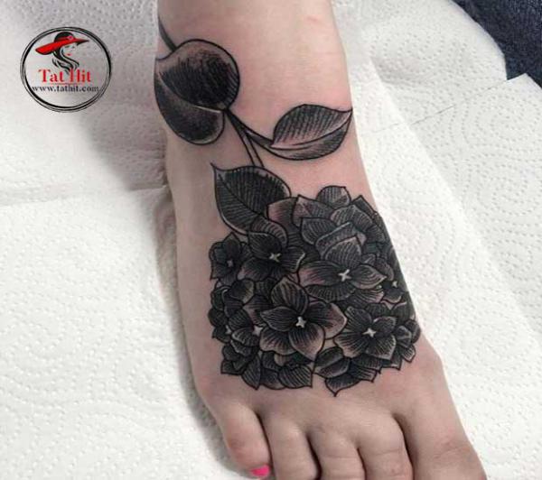 Black hydrangea foot tattoo