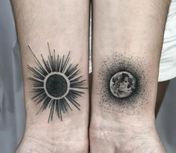 Blackwork Sun and moon wrist tattoo