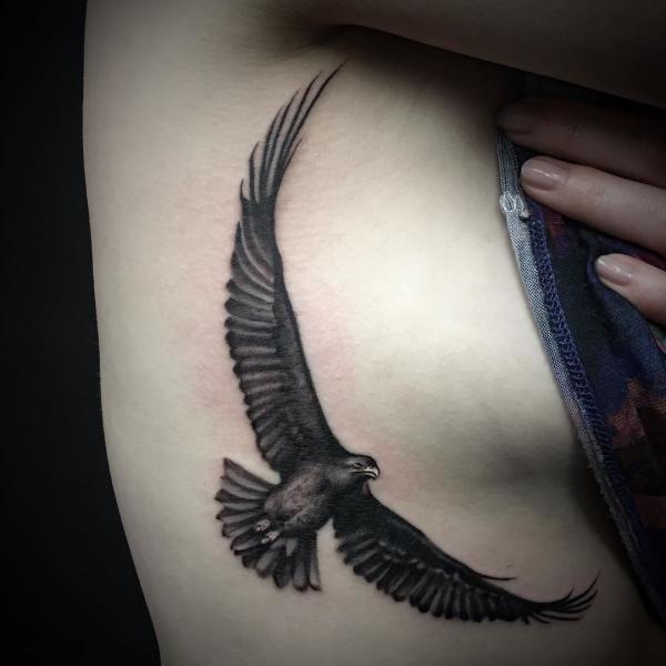 Blackwork eagle side boob tattoo