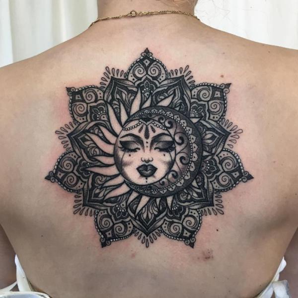 Blackwork manadala sun and moon back tattoo