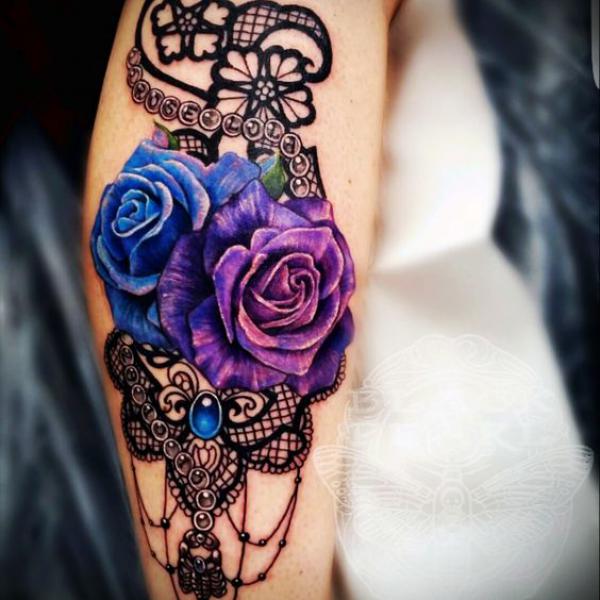 Blue and purple roses on lace tattoo