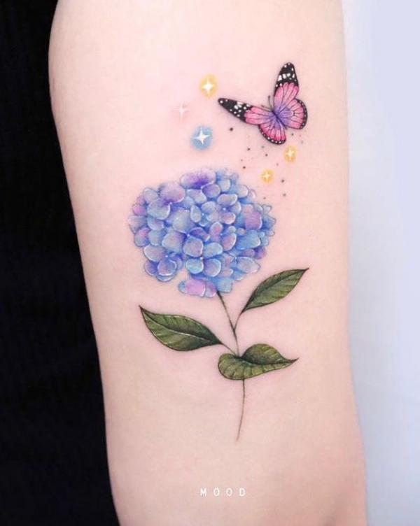 Blue hydrangea and butterfly with stars tattoo