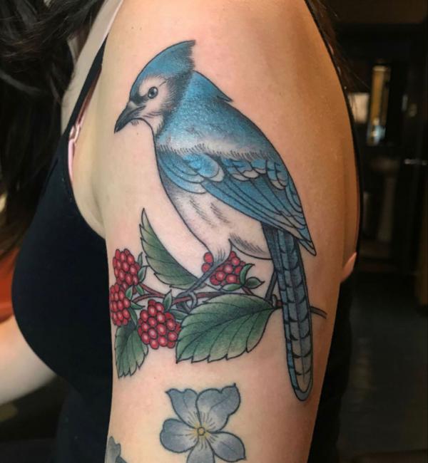 Blue jay with raspberries tattoo on upper arm 1