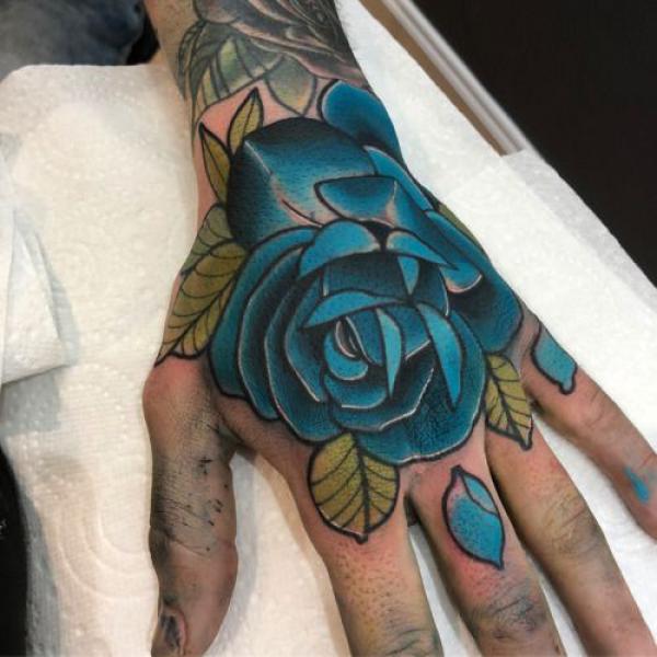 Blue rose hand tattoo