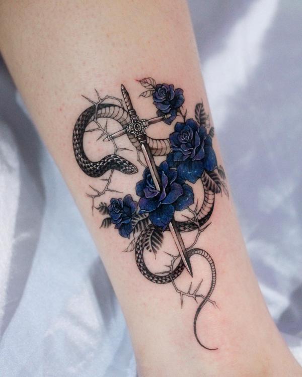 Blue roses with a snake and dagger