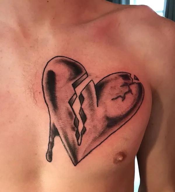 Broken heart chest tattoo