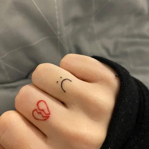 Broken heart finger tattoo