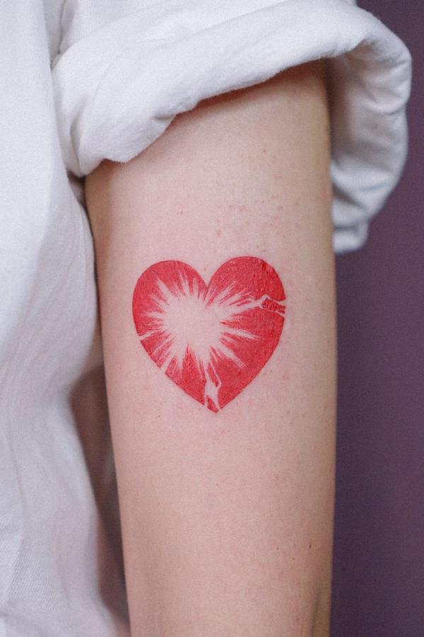 Broken heart upper arm tattoo