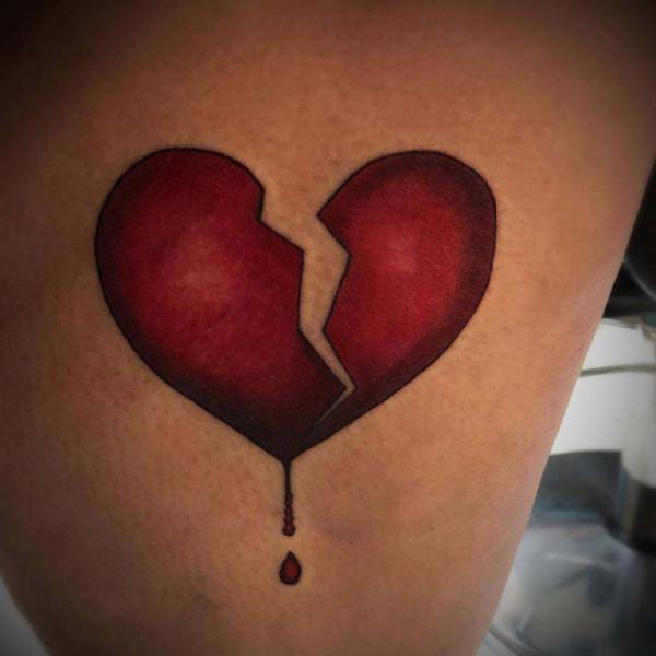 Broken heart with dripping blood tattoo