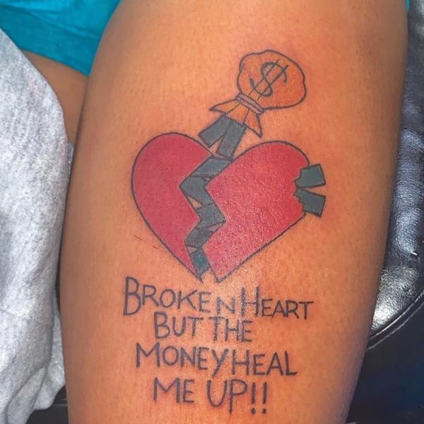 Broken heart with money tattoo