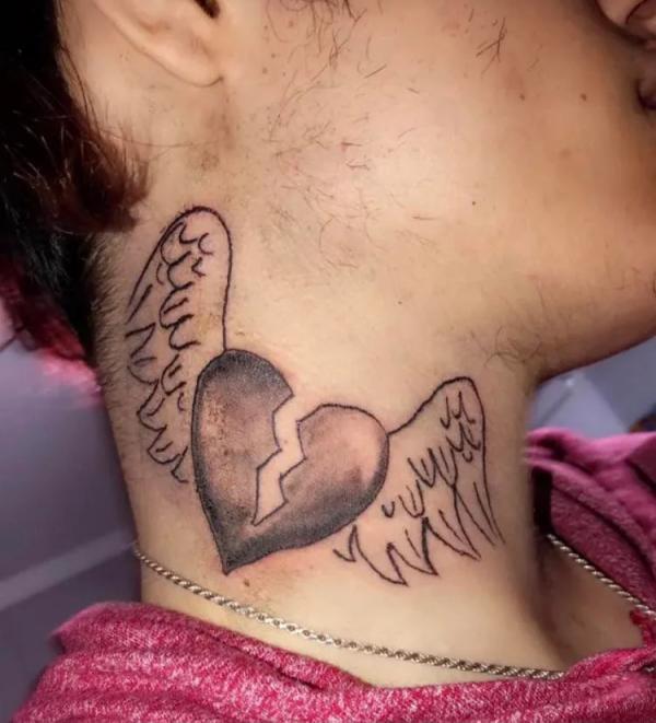 Broken heart with wings neck tattoo