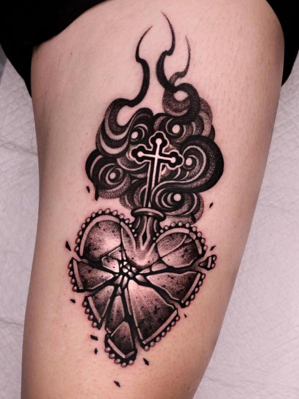 Broken sacred heart with cross tattoo