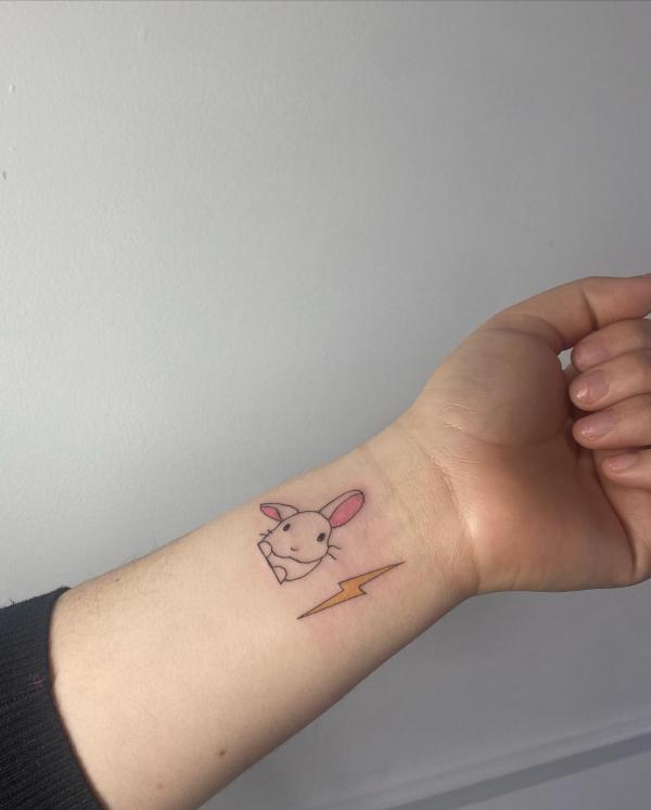 Bunny and lightning bolt wrist tattoo