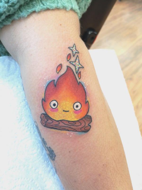 Calcifer outer forearm tattoo