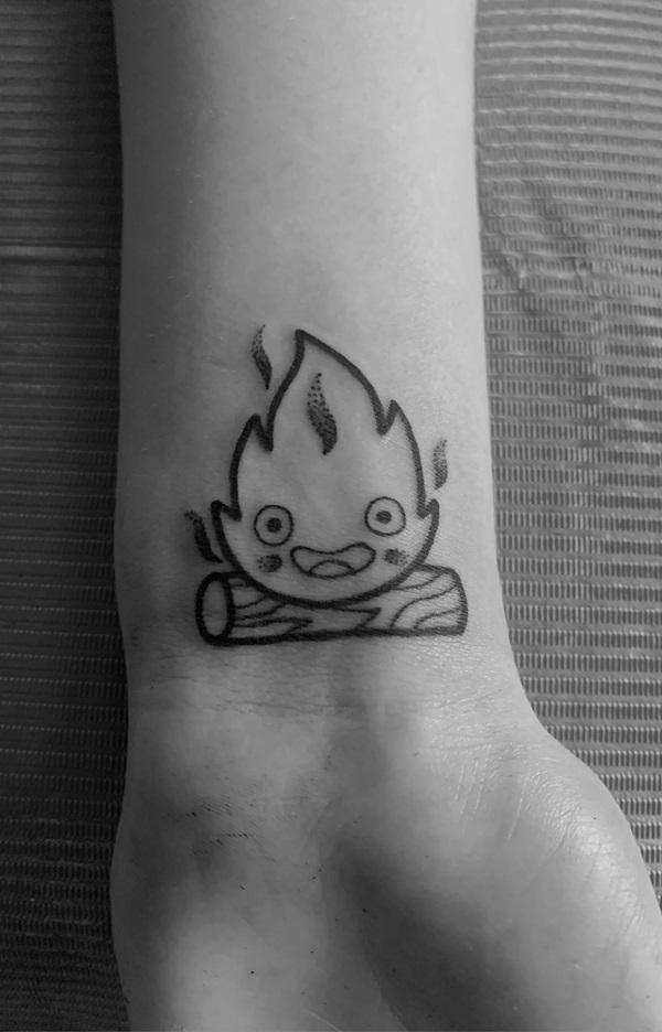 Calcifer outline wrist tattoo