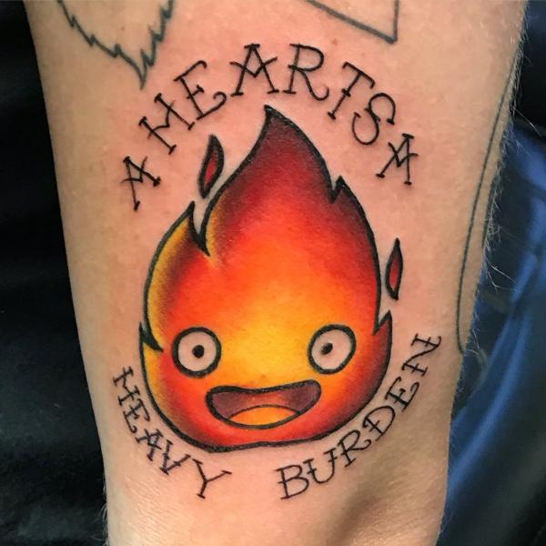 Calcifer tattoo with quote A heart a heavy burden