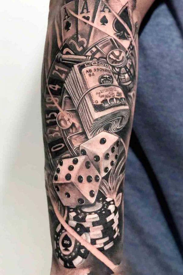 Cards money and dices tattoo sleeve