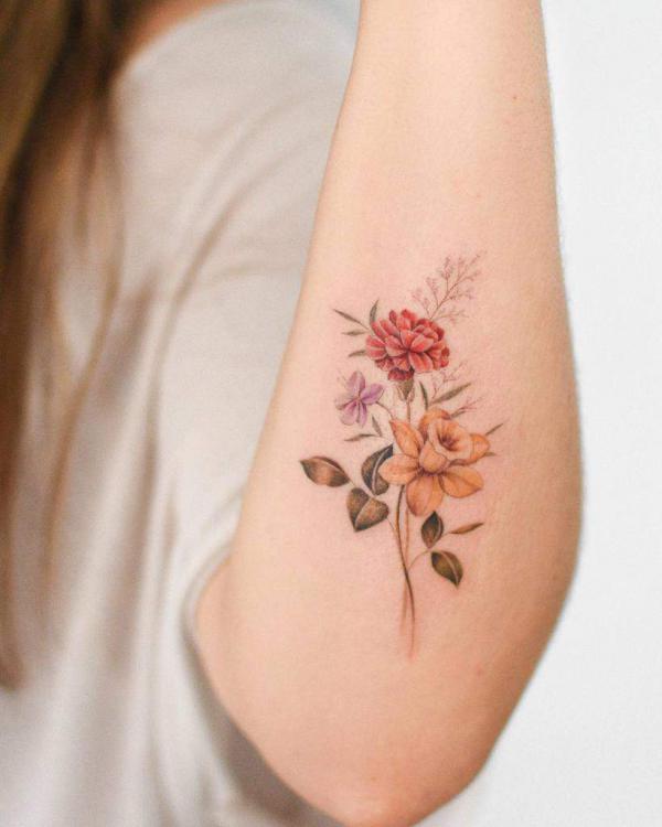 Carnation and daffodil tattoo