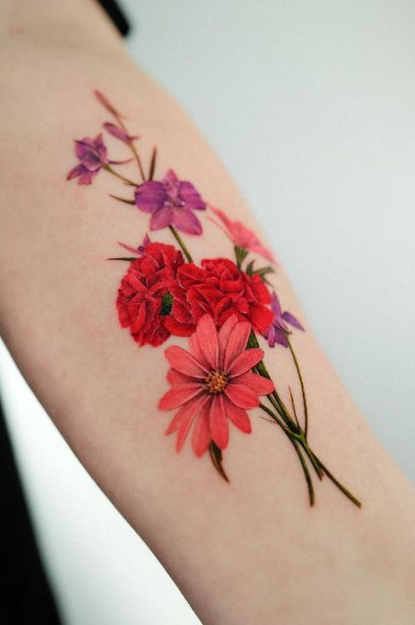 Carnation and daisy tattoo