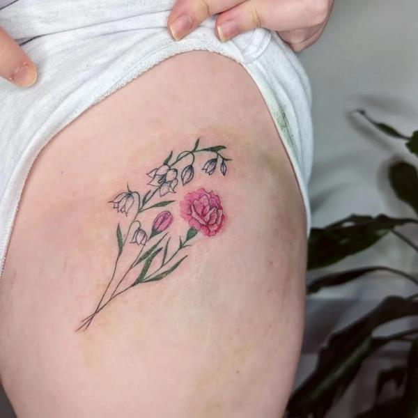 Carnation and lily of the valley tattoo