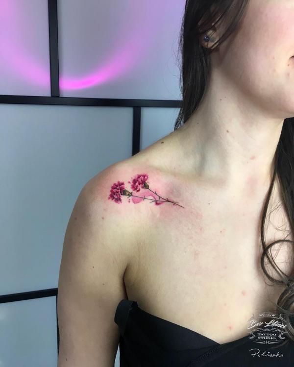 Carnation clavicle tattoo