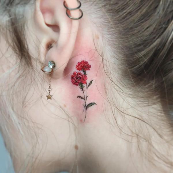 Carnation tattoo behind ear