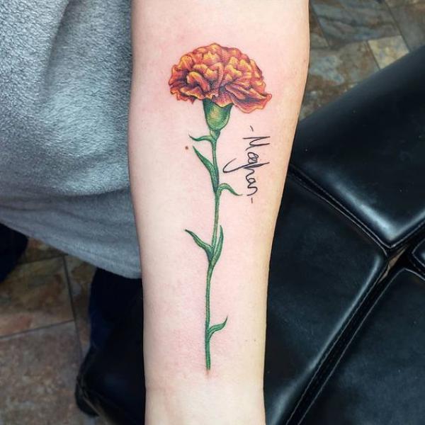 Carnation tattoo with name