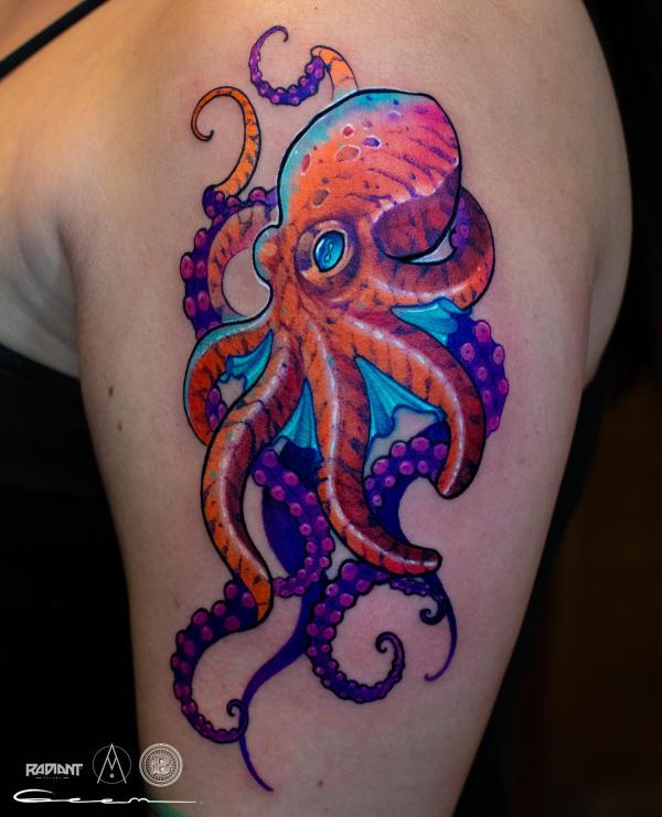 Colorful octopus tattoo on upper arm