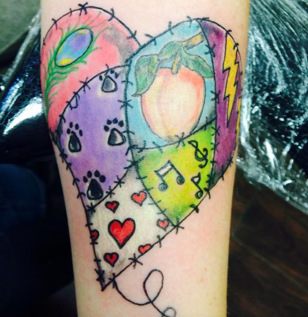 Colorful stitched broken heart tattoo