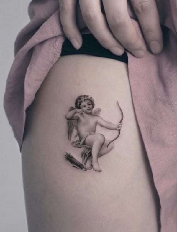 Cupid with bow tattoo