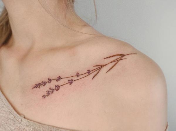Dainty lavender clavicle tattoo