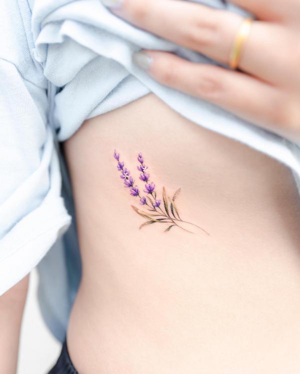Dainty lavender tattoo on side