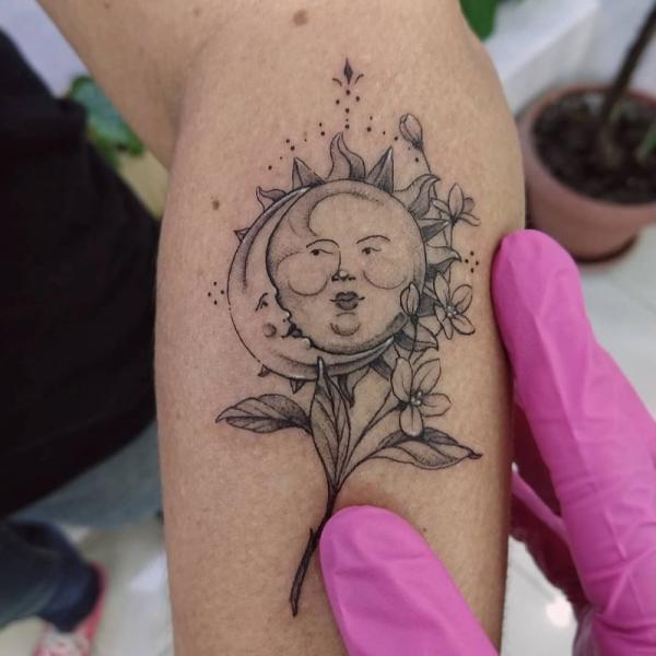 Dainty sun and moon and flowers tattoo