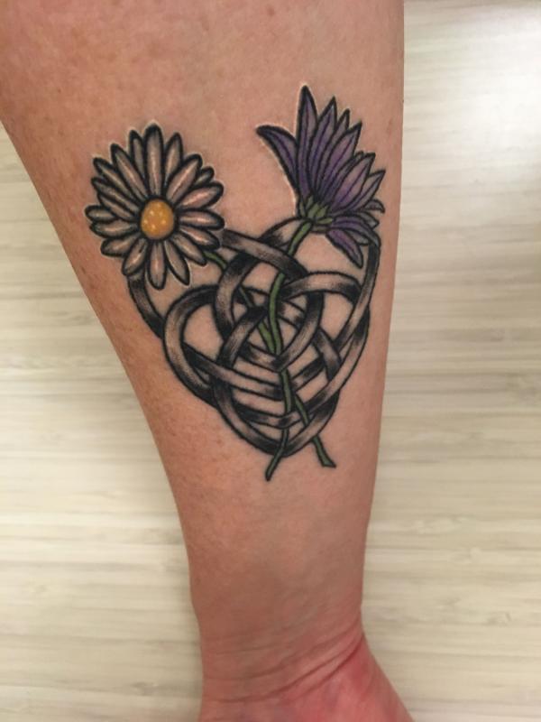 Daisy and Celtic Knot Motherhood tattoo
