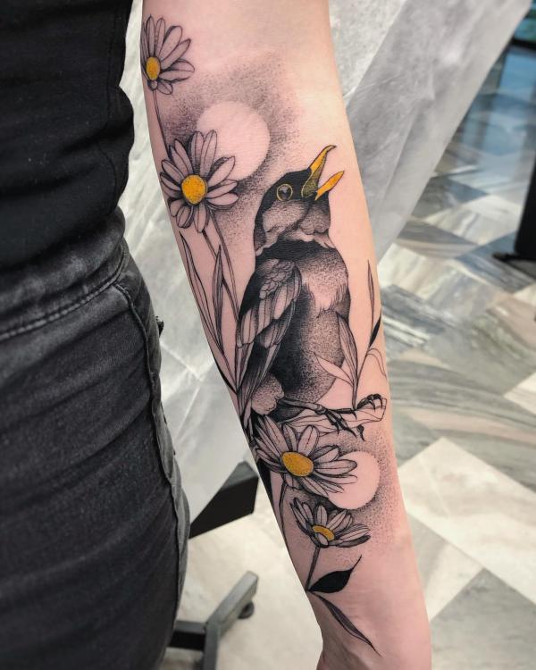 Daisy and bird tattoo