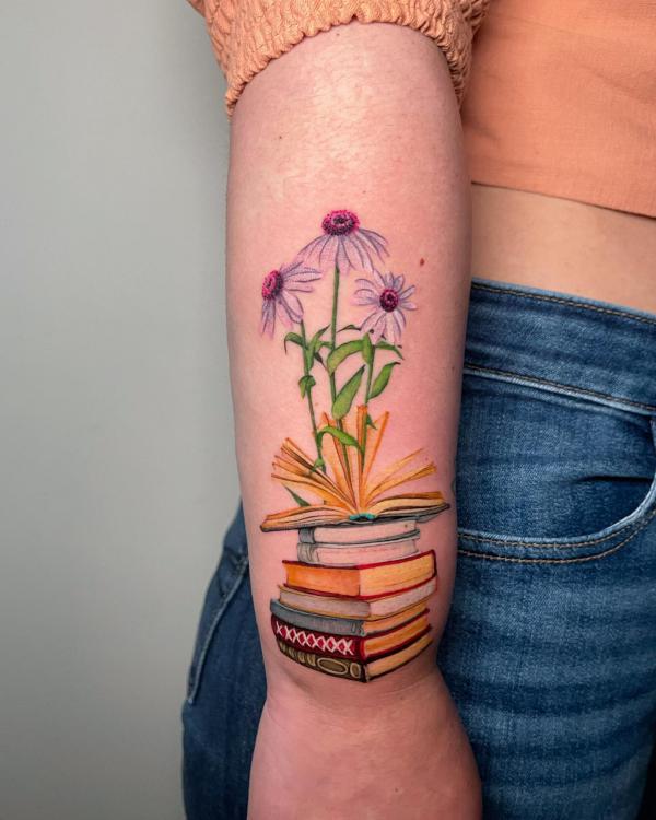 Daisy and book tattoo