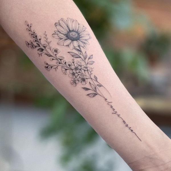 Daisy and delphinium tattoo