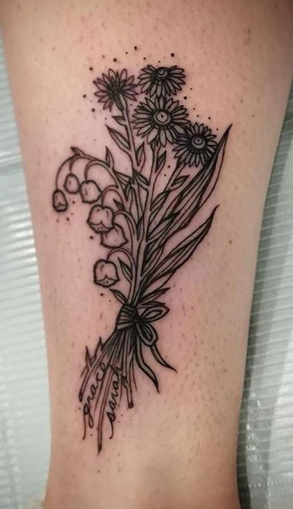 Daisy and lily of the valley tattoo