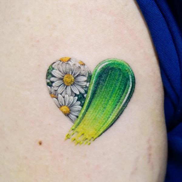 Daisy and stroke heart tattoo