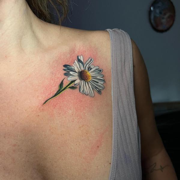 Daisy collar bone tattoo
