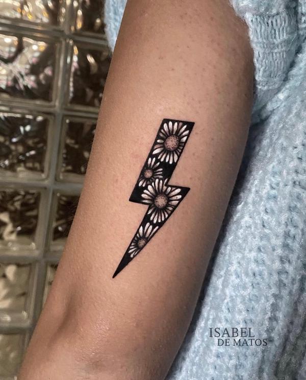 Daisy lightning bolt tattoo
