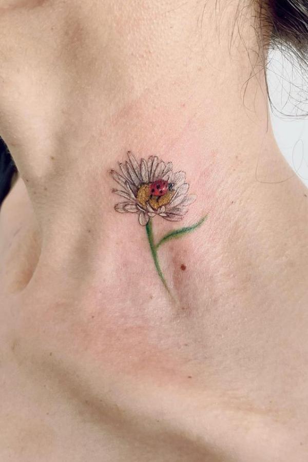 Daisy neck tattoo