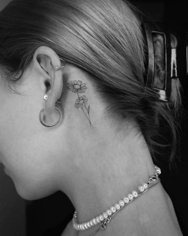 Daisy tattoo behind ear