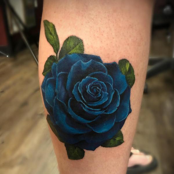 Dark blue rose tattoo