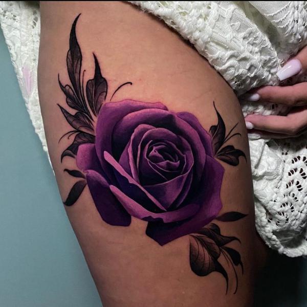 Dark purple rose thigh tattoo