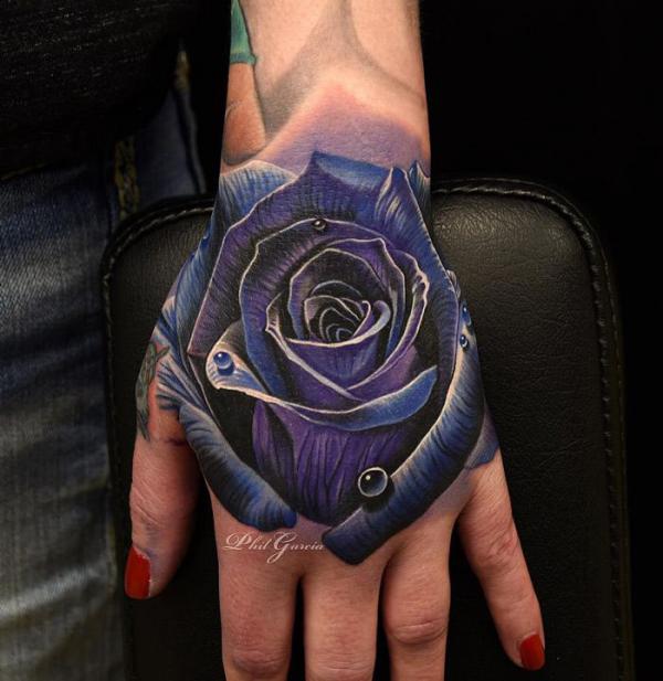 Dark purple rose hand tattoo