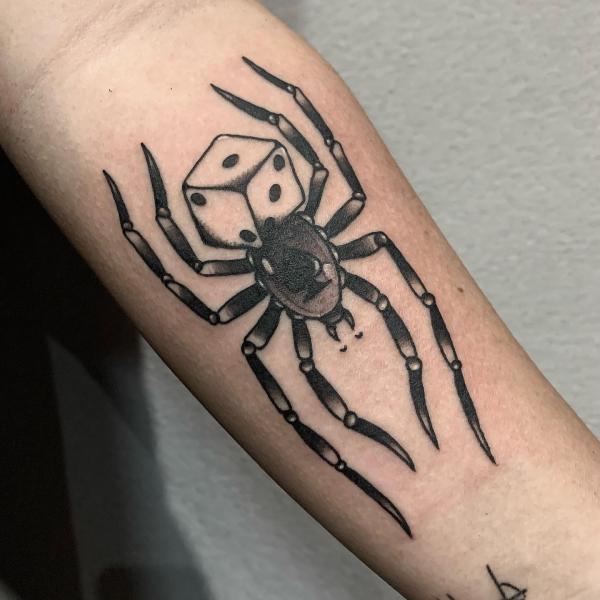Dice and spider tattoo
