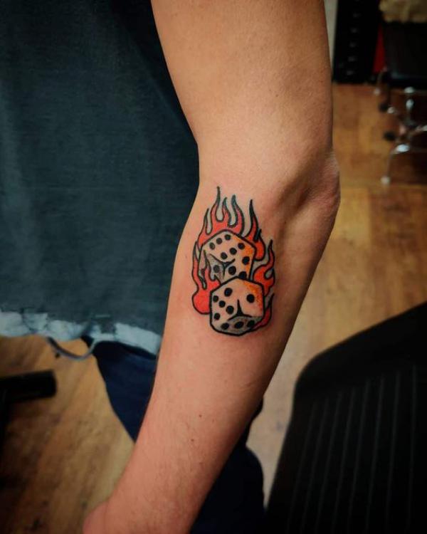 Dice in flame tattoo