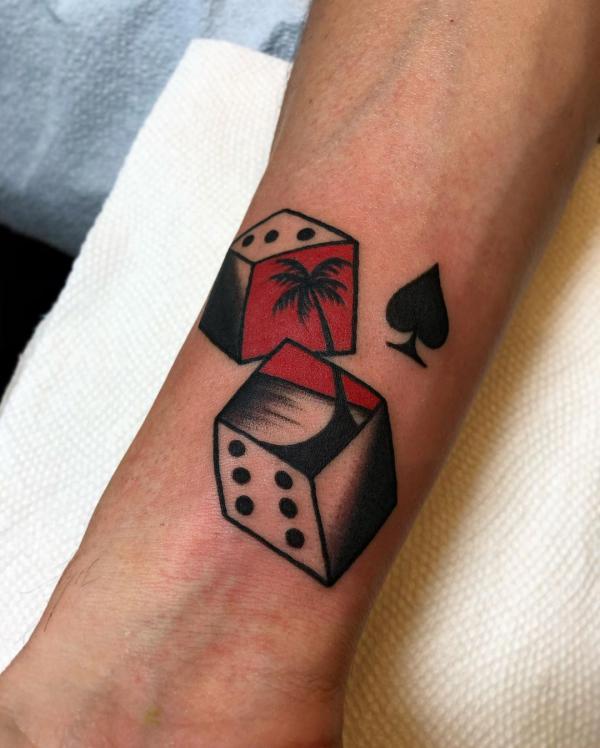 Dices and palm tree tattoo
