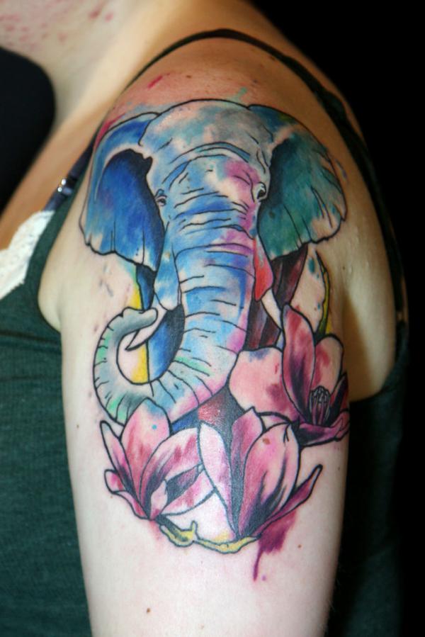 Elephant and Magnolia quarter sleeve tattoo in watercolor style
